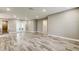 This living room includes recessed lighting and updated wood-look flooring at 8330 Lafitte Dr, Hudson, FL 34667