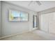 Neutral bedroom with closet, carpet and an outside door at 8425 112Th St # 203, Seminole, FL 33772