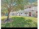 Exterior shot of a two-story building with green space at 8425 112Th St # 203, Seminole, FL 33772