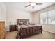 Bedroom featuring a ceiling fan and a window for natural light with carpet flooring at 8518 Tidal Breeze Dr, Riverview, FL 33569