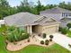 Beautiful single-story home with manicured landscaping, stone accents, and a welcoming entrance at 8518 Tidal Breeze Dr, Riverview, FL 33569