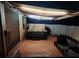 This outdoor hot tub and patio area features an adjustable awning with lights at 8518 Tidal Breeze Dr, Riverview, FL 33569
