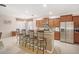 Spacious kitchen with bar seating, stainless steel appliances, and ample cabinet space at 8518 Tidal Breeze Dr, Riverview, FL 33569