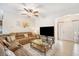Comfortable living room with plush seating, ceiling fan, and ample natural light at 8518 Tidal Breeze Dr, Riverview, FL 33569