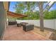 Outdoor patio with cozy seating area, hot tub and retractable awning for shade at 8518 Tidal Breeze Dr, Riverview, FL 33569