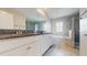 Bathroom featuring granite counters, double sinks, a soaking tub, and a glass-enclosed shower at 8747 Flourish Dr, Land O Lakes, FL 34637