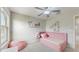 Bright bedroom with modern decor, a ceiling fan, and plenty of natural light at 8747 Flourish Dr, Land O Lakes, FL 34637