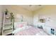 Inviting bedroom featuring a ladder with greenery, vanity, and ample natural light at 8747 Flourish Dr, Land O Lakes, FL 34637