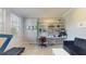 Bright office space features a treadmill, modern shelving with greenery, and a comfortable seating area at 8747 Flourish Dr, Land O Lakes, FL 34637