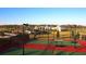 Tennis courts with the community center in the background at 8747 Flourish Dr, Land O Lakes, FL 34637