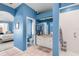 Large blue bathroom featuring a step in shower, soaking tub and vanity at 9116 Woodridge Run Dr, Tampa, FL 33647