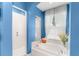 A stylish bathroom boasts a soaking tub, tiled shower, and natural light at 9116 Woodridge Run Dr, Tampa, FL 33647