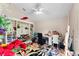 Cozy bedroom with vaulted ceiling, ceiling fan, large rug and ample storage space at 9116 Woodridge Run Dr, Tampa, FL 33647