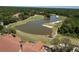 An aerial view of the community golf course including a water hazard at 9116 Woodridge Run Dr, Tampa, FL 33647