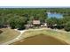 Aerial view of a cozy structure nestled near a serene lake and golf course at 9116 Woodridge Run Dr, Tampa, FL 33647