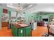 Spacious kitchen with hardwood floors, a center island, an abundance of storage, and modern appliances at 9116 Woodridge Run Dr, Tampa, FL 33647