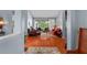 Cozy living room featuring hardwood floors, neutral paint, and large sliding glass doors to the outdoors at 9116 Woodridge Run Dr, Tampa, FL 33647