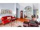 Inviting space featuring hardwood floors, art, neutral paint, and an open floor plan at 9116 Woodridge Run Dr, Tampa, FL 33647