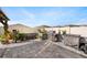 Well-equipped outdoor kitchen with stainless steel grill and cooktop, surrounded by a beautifully paved patio at 9334 Lemon Drop Loop, Sun City Center, FL 33573