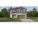 Charming two-story home with neutral siding, inviting entrance, and attached two car garage at 9437 Raised Tulip Ln, Land O Lakes, FL 34637