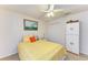 Bright bedroom with ceiling fan, closet and closet-style storage at 1857 N San Mateo Dr, North Port, FL 34288