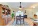 Inviting dining room featuring a tall table, charming rug, and built-in hutch perfect for entertaining at 1857 N San Mateo Dr, North Port, FL 34288