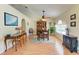 Open dining area with stylish furniture and a vaulted ceiling, creating an elegant space for gatherings at 1857 N San Mateo Dr, North Port, FL 34288