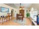 Cozy dining area featuring warm natural light, a hutch, and a ceiling fan at 1857 N San Mateo Dr, North Port, FL 34288