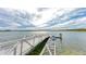 Picturesque lake featuring a dock perfect for water activities and kayaking with calm waters at 1857 N San Mateo Dr, North Port, FL 34288