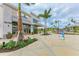 Modern storefront with large windows, awnings, and well-maintained landscaping in a commercial area at 1857 N San Mateo Dr, North Port, FL 34288
