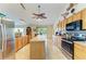 Spacious kitchen features stainless steel appliances, a central island, and tile flooring at 1857 N San Mateo Dr, North Port, FL 34288