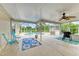 Relaxing screened-in lanai with outdoor seating and a view of the sparkling pool at 1857 N San Mateo Dr, North Port, FL 34288