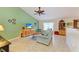 Inviting living room with vaulted ceilings, tile flooring, and comfortable seating arrangement at 1857 N San Mateo Dr, North Port, FL 34288