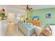 Living room featuring sofa, tv, and tiled flooring at 1857 N San Mateo Dr, North Port, FL 34288