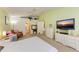 Generous bedroom features neutral carpeting, ceiling fan, sitting area, and ensuite bathroom access at 1857 N San Mateo Dr, North Port, FL 34288
