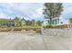 Inviting outdoor seating area with well-manicured lawns and building views at 1857 N San Mateo Dr, North Port, FL 34288