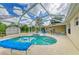 Relaxing pool area featuring a spa and ample lounge space, ideal for soaking up the sun at 1857 N San Mateo Dr, North Port, FL 34288