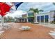 Oak & Stone restaurant with outdoor seating, palm trees, and shade structures at 1857 N San Mateo Dr, North Port, FL 34288