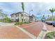 Charming street view showcasing upscale buildings, outdoor dining, and street-side parking at 1857 N San Mateo Dr, North Port, FL 34288