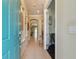 Bright foyer with tile flooring, elegant archways, and a view into the home's interior at 11307 Quiet Forest Dr, Tampa, FL 33635