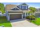 Beautiful two-story home with a two-car garage, nice landscaping, and inviting curb appeal at 11307 Quiet Forest Dr, Tampa, FL 33635