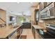 Spacious kitchen with a center island, stainless steel appliances, and an adjoining living room at 11307 Quiet Forest Dr, Tampa, FL 33635