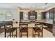 A gourmet kitchen with granite countertops, stainless steel appliances, and a tile backsplash at 11307 Quiet Forest Dr, Tampa, FL 33635