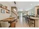 Open concept living space with dining area, stairs, a kitchen bar, and lots of natural light at 11307 Quiet Forest Dr, Tampa, FL 33635