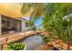 Beautiful backyard featuring a koi pond with lush landscaping, a water feature, and a charming covered patio at 11423 Brighton Knoll Loop, Riverview, FL 33579