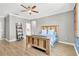 Comfortable bedroom with wood floors, natural light, and serene ambiance, perfect for relaxing and resting at 11423 Brighton Knoll Loop, Riverview, FL 33579