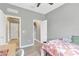 Cozy bedroom featuring light gray walls and a walk-in closet at 11423 Brighton Knoll Loop, Riverview, FL 33579