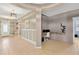 Open-concept foyer featuring tile flooring, modern light fixtures, and flex room at 11423 Brighton Knoll Loop, Riverview, FL 33579