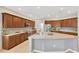 Spacious kitchen featuring a large island with granite countertops and ample cabinet space at 11423 Brighton Knoll Loop, Riverview, FL 33579