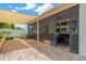 View of screened patio with covered area, brick flooring, and shade screen at 11423 Brighton Knoll Loop, Riverview, FL 33579